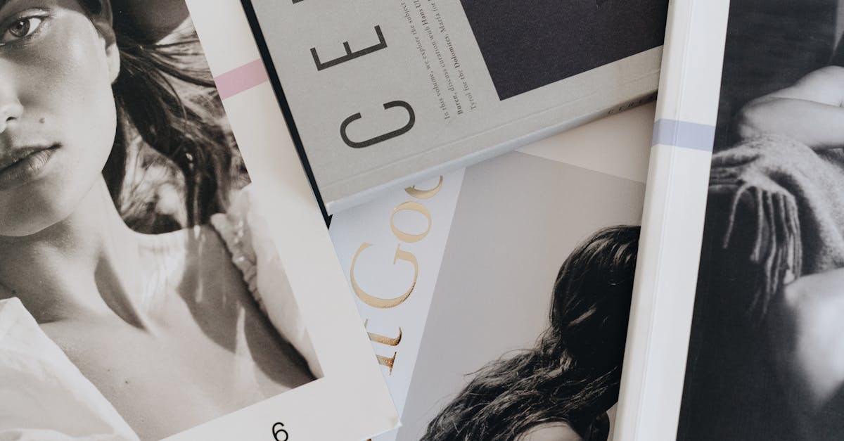 A close-up view of artistic and fashion magazines laid out on a table.